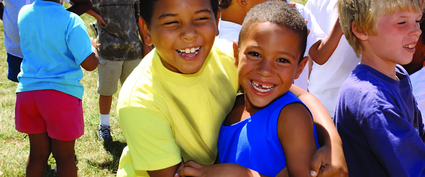 Two boys hugging