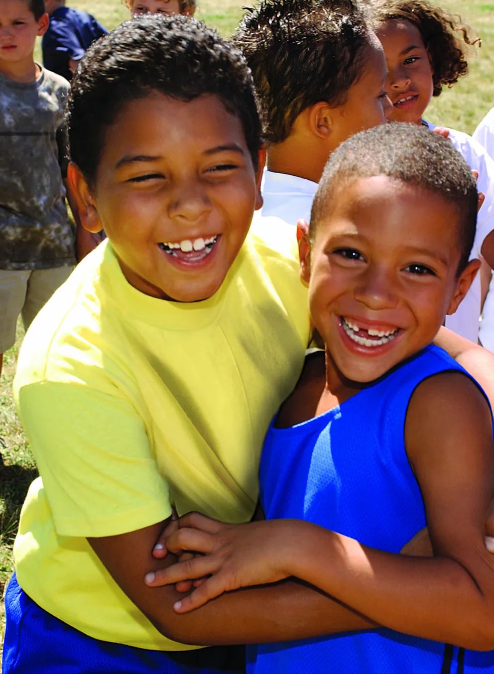 Two boys hugging