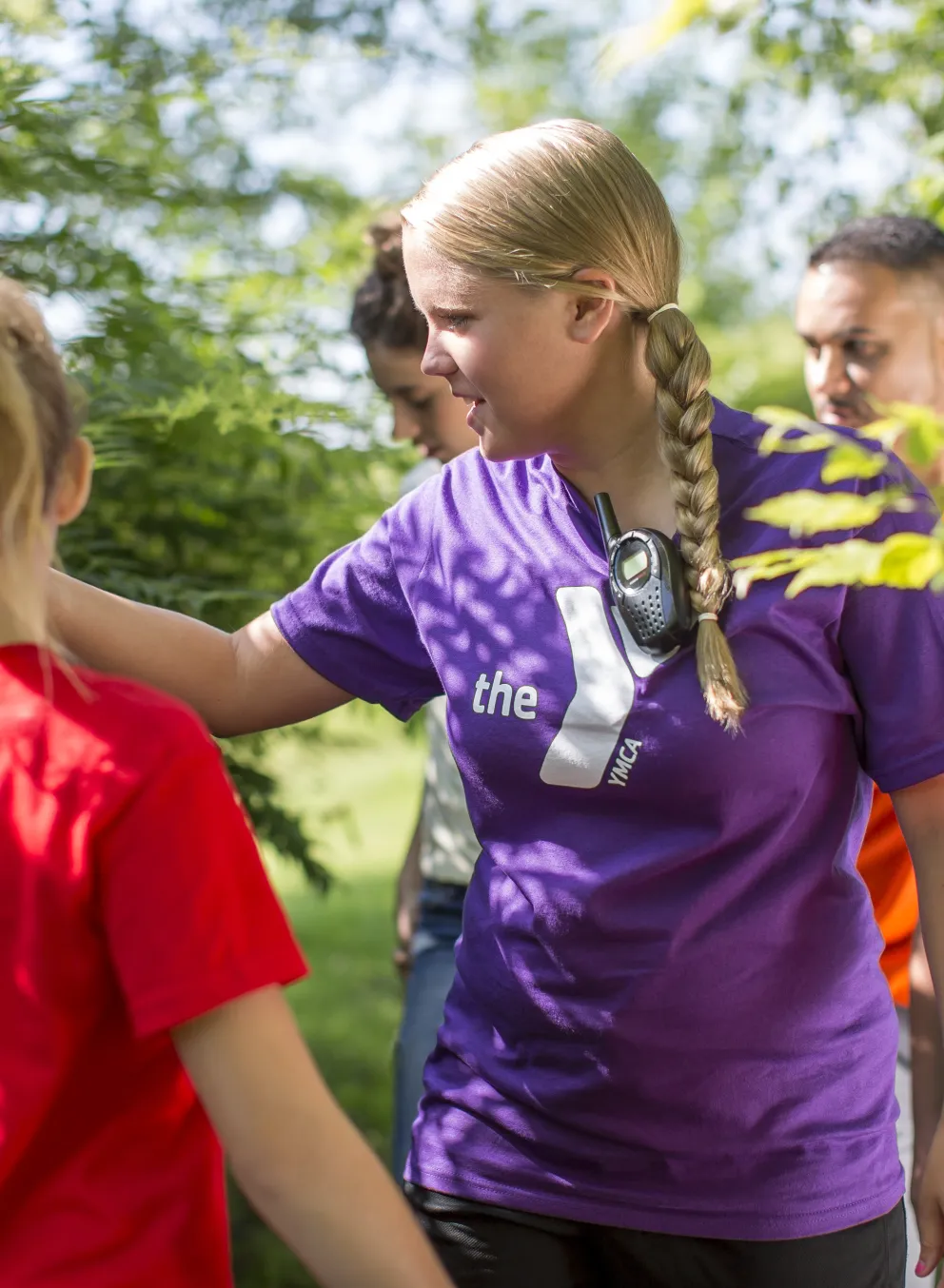 Female counselor showing campers nature