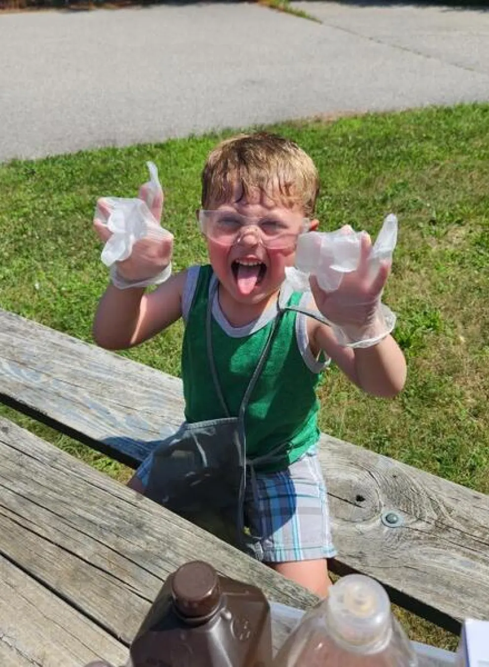 Boy doing a science experiment on a picnic table