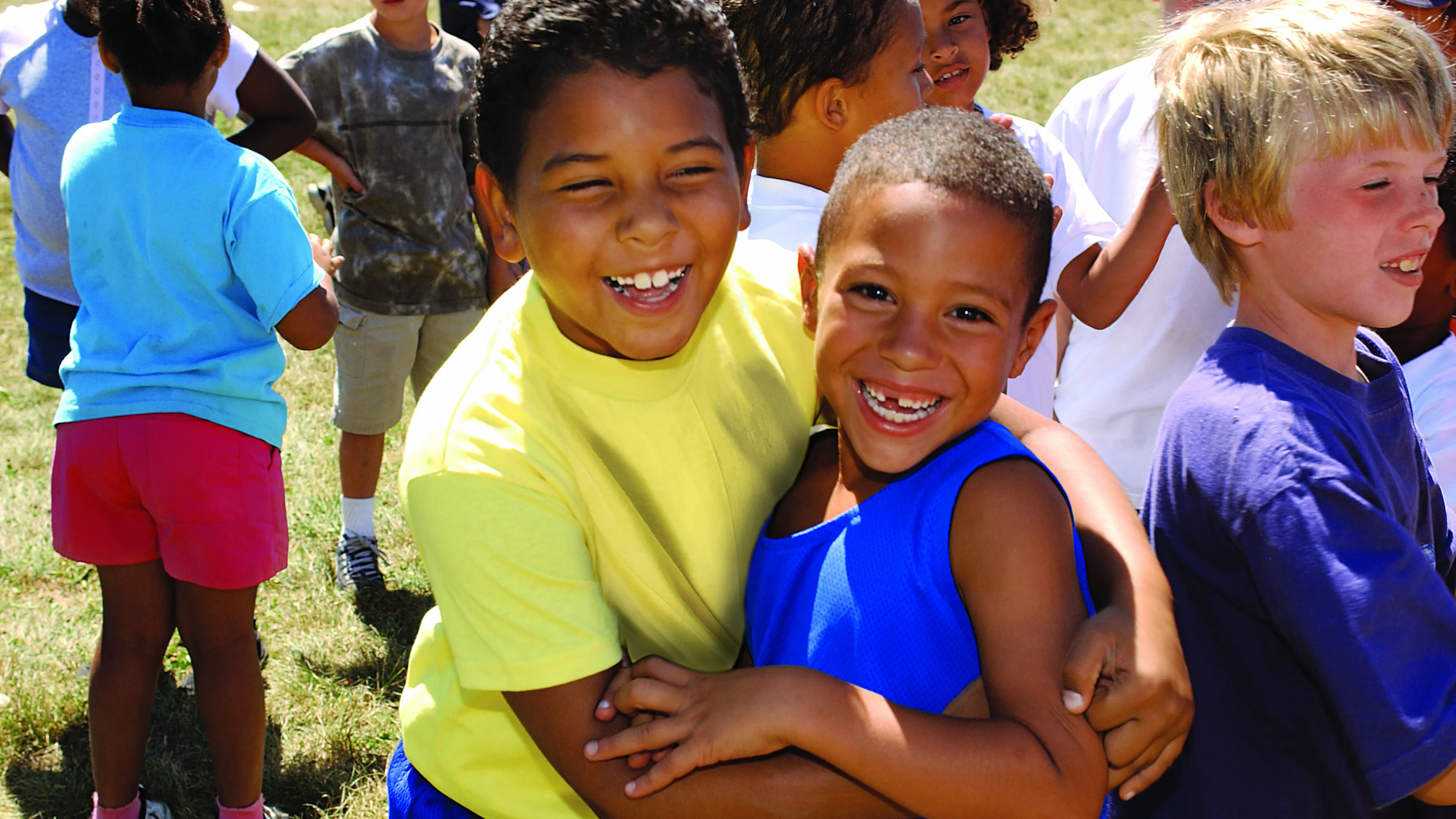 Two boys hugging