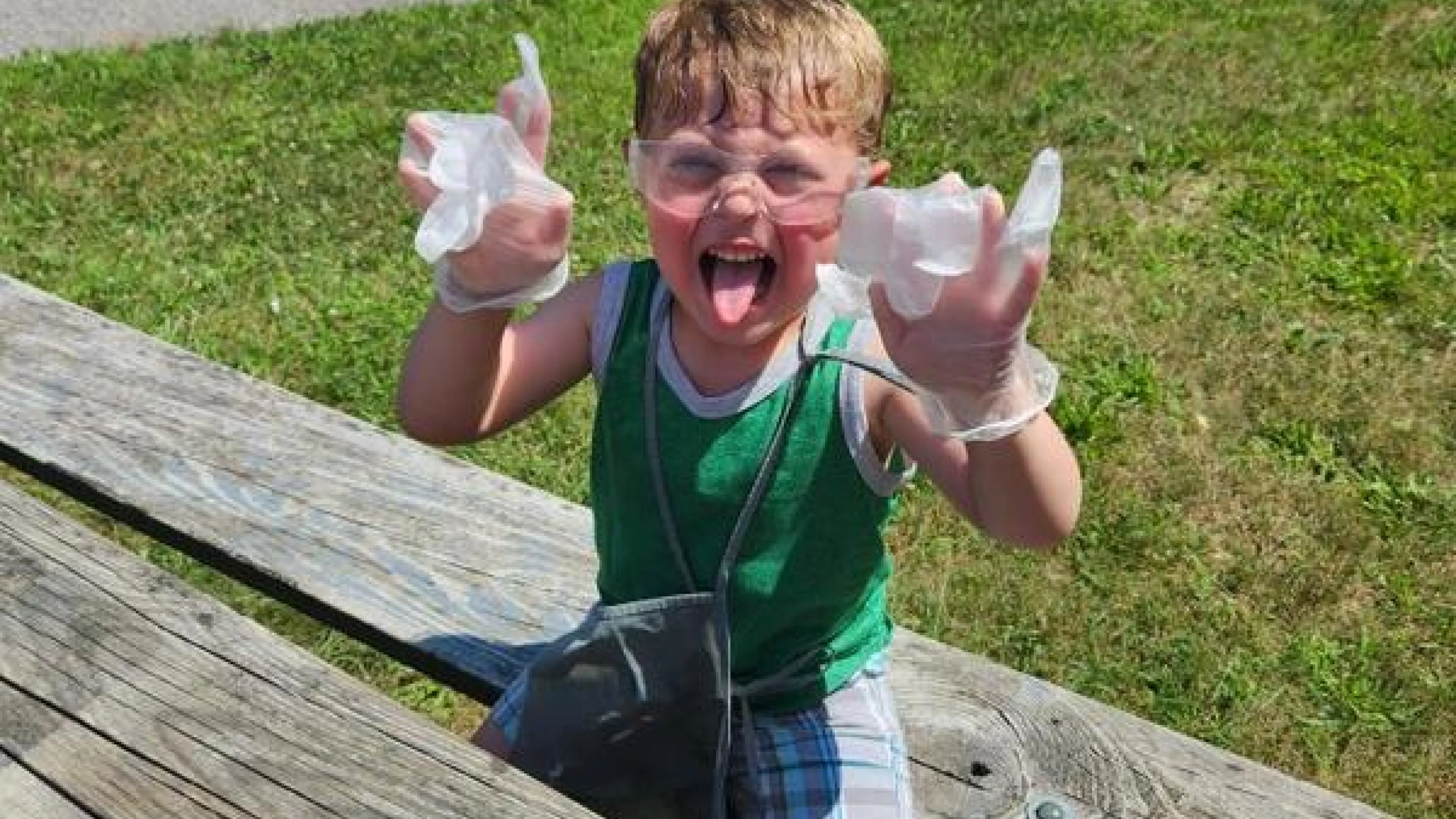 Boy doing a science experiment on a picnic table