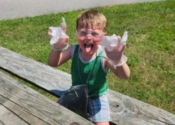 Boy doing a science experiment on a picnic table