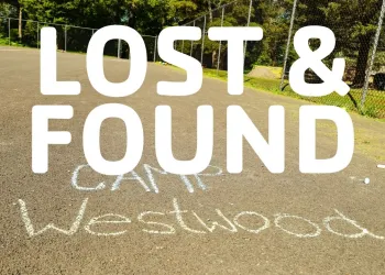 Basketball Court with Camp Westwood written in chalk and the words Lost &amp; Found.